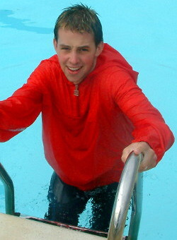 pool boy with anorak in pool